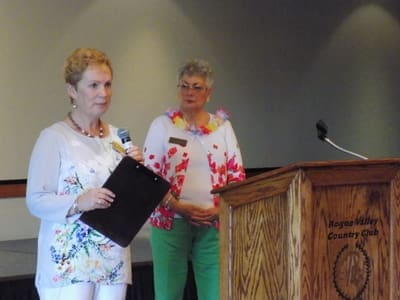 President-elect, Annette Godfrey, and current president Maxine Williams, share some information with the group.