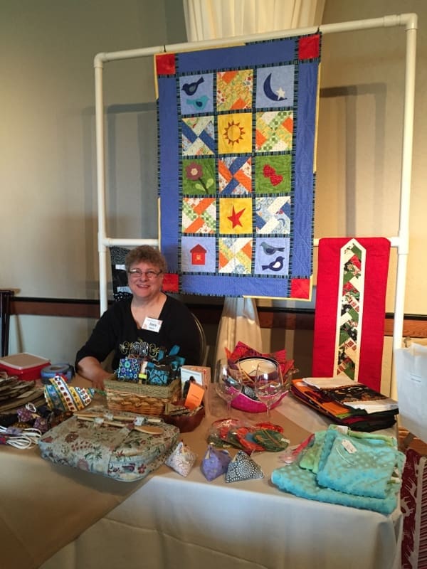 Dora Moore staffs a table for the Knotty Ladies