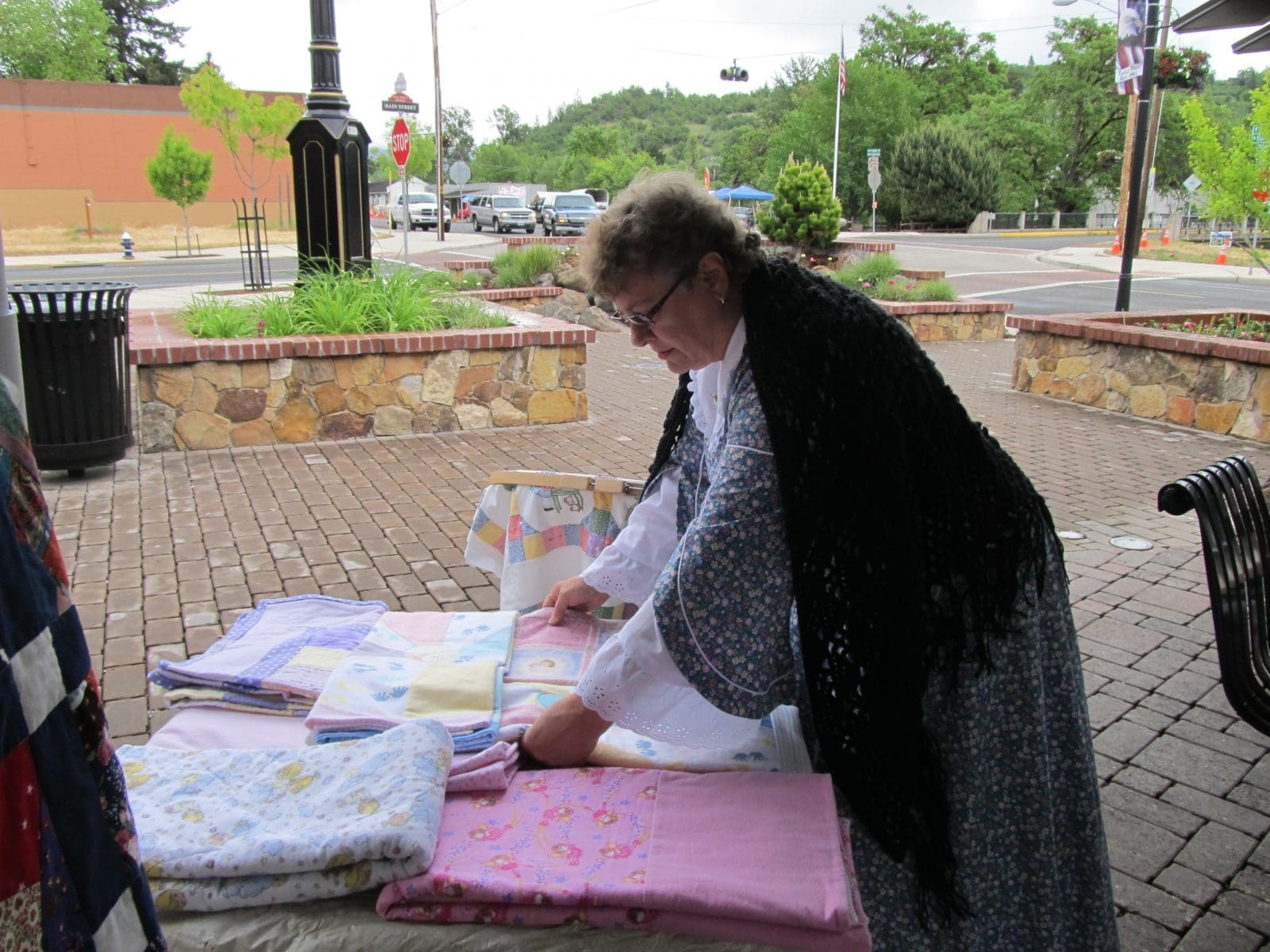 Dora-displays-the-baby-quilts